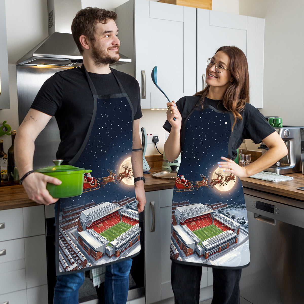 Liverpool Christmas Stadium Apron - couple in kitchen
