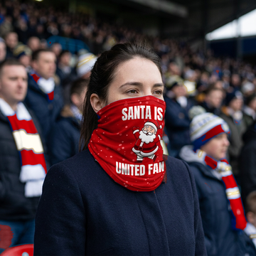 Man United Santa snood lifestyle photo in a football stadium